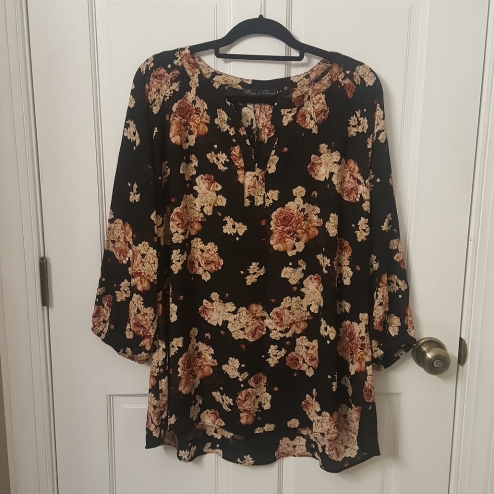NWT floral blouse on black background